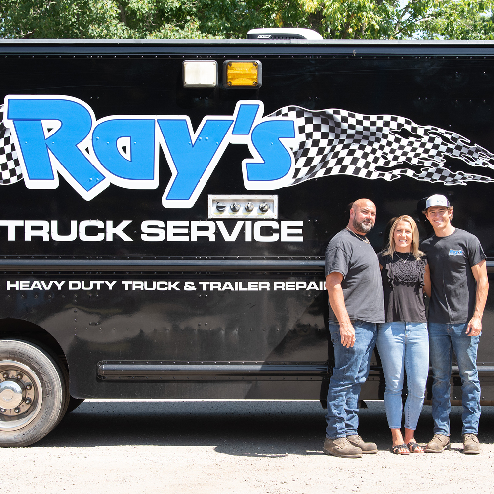 Photo of Shawn, Danielle & Kobe Gaudette Standing in front of a truck labelled 